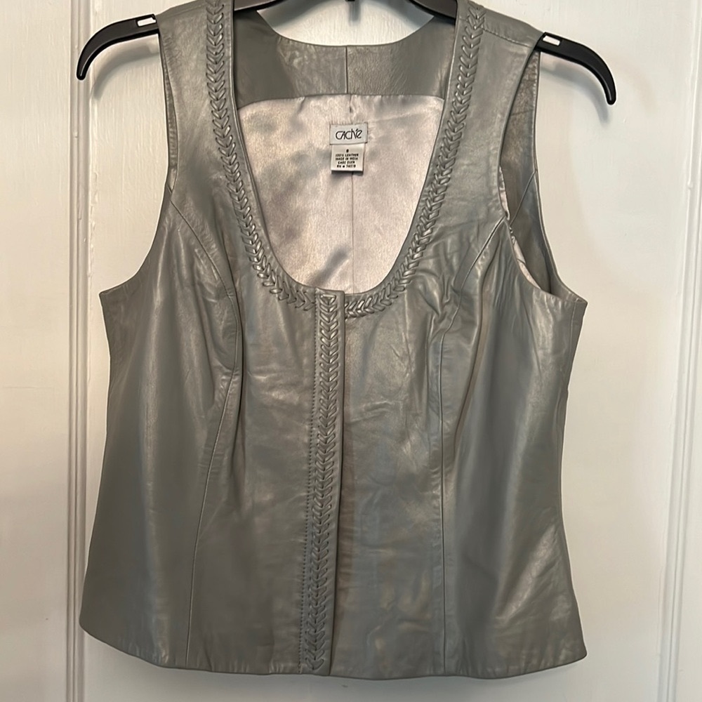 2 pieces   Soft leather pewter color leather vest and leather pants to match.